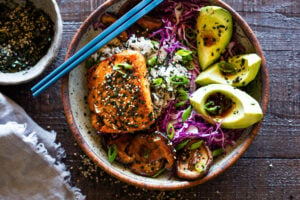 Here's a fast & healthy weeknight Dinner! Furikake Salmon Bowls- these delicious bowls are made with seared sesame salmon, shiitake mushrooms, avocado and cabbage. Make this in 30 minutes! #salmonbowl #keto #salmon #furikake