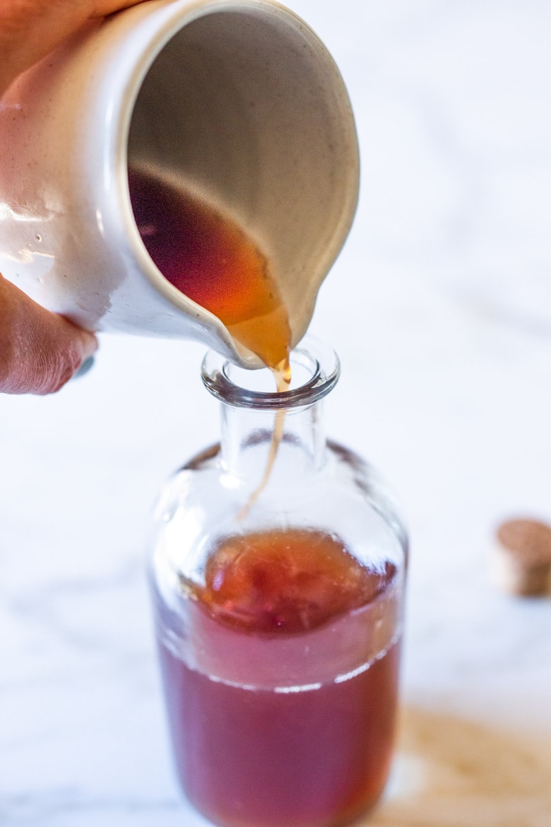 A simple Rose Tincture that opens the heart, quiets the mind and soothes the soul. Calming and uplifting it aids in our overall wellbeing, balancing all 3 doshas. Made with simple ingredients, this takes only 15 minutes of hands-on time! Add a splash of this Wild Rose Elixer to sparkling water, champagne, tea, or cocktails. #tincture #rose #elixir #lovepotion 