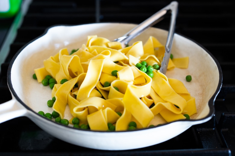 Vegan Alfredo for two, tossed in a delicious cashew (or hemp) cream, with sauteed mushrooms, Meyer lemon zest and a secret ingredient that gives this extra complexity and depth. Can be made in under 30 minutes! #veganalfredo #veganalfredosauce