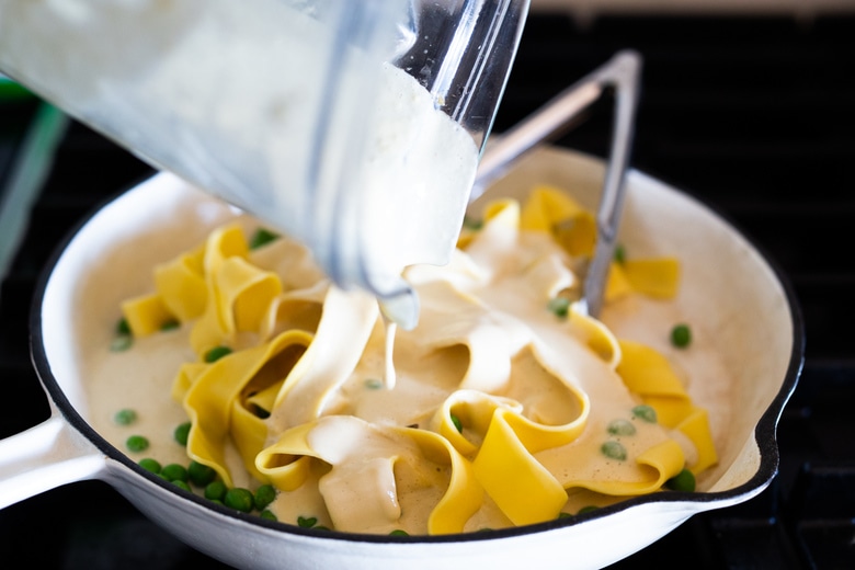 Vegan Alfredo for two, tossed in a delicious cashew (or hemp) cream, with sauteed mushrooms, Meyer lemon zest and a secret ingredient that gives this extra complexity and depth. Can be made in under 30 minutes! #veganalfredo #veganalfredosauce