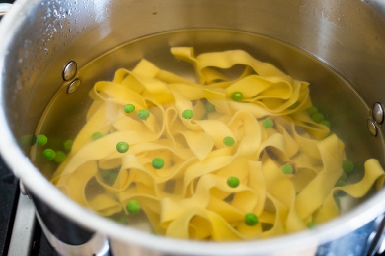 Vegan Alfredo for two, tossed in a delicious cashew (or hemp) cream, with sauteed mushrooms, Meyer lemon zest and a secret ingredient that gives this extra complexity and depth. Can be made in under 30 minutes! #veganalfredo #veganalfredosauce