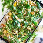 Warm Winter Salad - a hearty, Middle Eastern salad made on a sheet pan with roasted cauliflower, carrots, fennel and chickpeas, topped with wilting spinach, drizzled with Everyday Tahini Sauce and sprinkled with fresh dill and Dukkah. Vegan and Gluten-free. #sheetpandinner #warmsalad #vegansalad #sheetpanmeal #wintersalad #spinachsalad #cauliflowersalad #wintersalad #warmsalad