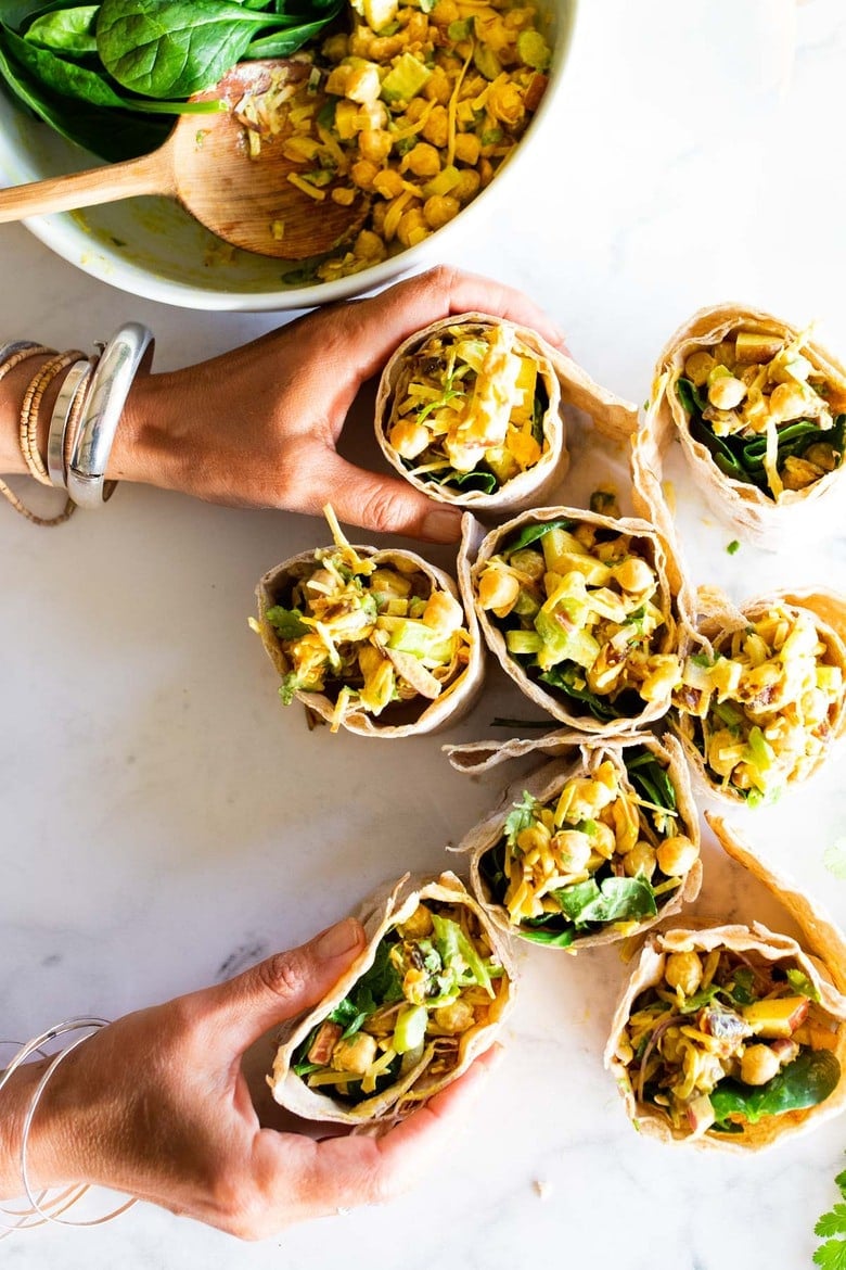 A simple vegan recipe for Curry Chickpea Salad, that can be turned into a wrap with spinach and sprouts. A healthy vegan lunch idea! #veganwrap #currychickpeawrap