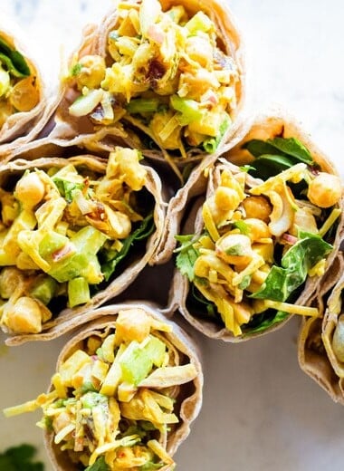 Vegan Curry Chickpea Salad Wrap with cashews, coconut, dates and celery.