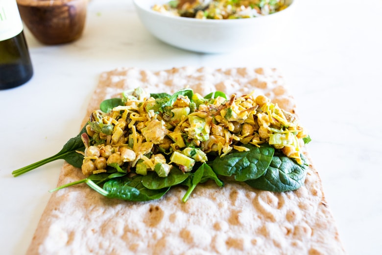 A simple vegan recipe for Curry Chickpea Salad, that can be turned into a wrap with spinach and sprouts. A healthy vegan lunch idea! #veganwrap #currychickpeawrap 