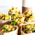 A simple vegan recipe for Curry Chickpea Salad, that can be turned into a wrap with spinach and sprouts. A healthy vegan lunch idea! #veganwrap #currychickpeawrap