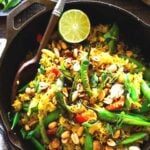 Fragrant, turmeric-infused, Indian Fried Rice full of healthy veggies that can be made in under 30 minutes. Vegetarian, Gluten-free, and Vegan adaptable, it is a fast and easy weeknight meal- great for using up leftover rice or stray veggies in the fridge.  Serve over a bed of spinach with optional Raita. 