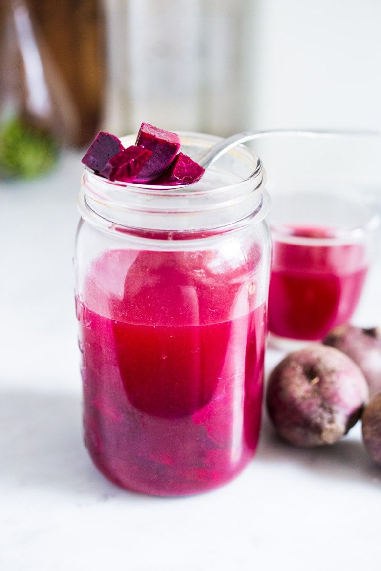 How to Make Beet Kvass! A sparkly Ukrainian probiotic drink made with beets, sea salt and water. Full of healthy probiotics from the Lacto-fermentation, Beet Kvass is believed to help boost immunity.  It tastes slightly sweet, tangy, earthy and salty- but in a good way! With just 10 minutes of hands-on time,it is so simple- just let mother nature take its course.  (Allow 2 weeks for fermentation- see notes for speeding up this process.)