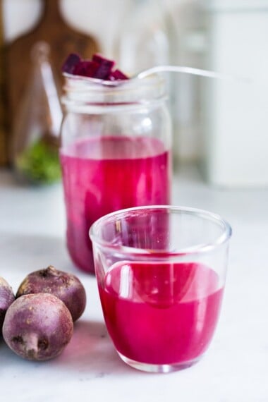 How to Make Beet Kvass! A sparkly Ukrainian probiotic drink made with beets, sea salt and water. Full of healthy probiotics from the Lacto-fermentation, Beet Kvass is believed to help boost immunity.  It tastes slightly sweet, tangy, earthy and salty- but in a good way! With just 10 minutes of hands-on time,it is so simple- just let mother nature take its course.  (Allow 2 weeks for fermentation- see notes for speeding up this process.)