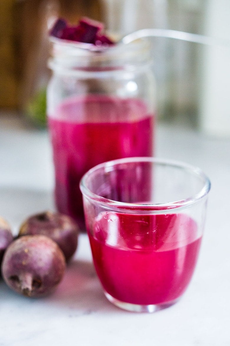 How to Make Beet Kvass! A sparkly Ukrainian probiotic drink made with beets, sea salt and water. Full of healthy probiotics from the Lacto-fermentation, Beet Kvass is believed to help boost immunity.  It tastes slightly sweet, tangy, earthy and salty- but in a good way! With just 10 minutes of hands-on time,it is so simple- just let mother nature take its course.  (Allow 2 weeks for fermentation- see notes for speeding up this process.)