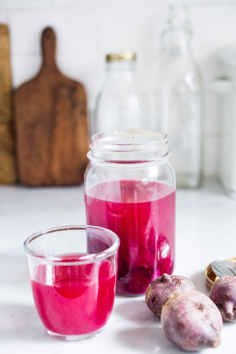 How to Make Beet Kvass! A sparkly Ukrainian probiotic drink made with beets, sea salt and water. Full of healthy probiotics from the Lacto-fermentation, Beet Kvass is believed to help boost immunity.  It tastes slightly sweet, tangy, earthy and salty- but in a good way! With just 10 minutes of hands-on time,it is so simple- just let mother nature take its course.  (Allow 2 weeks for fermentation- see notes for speeding up this process.)