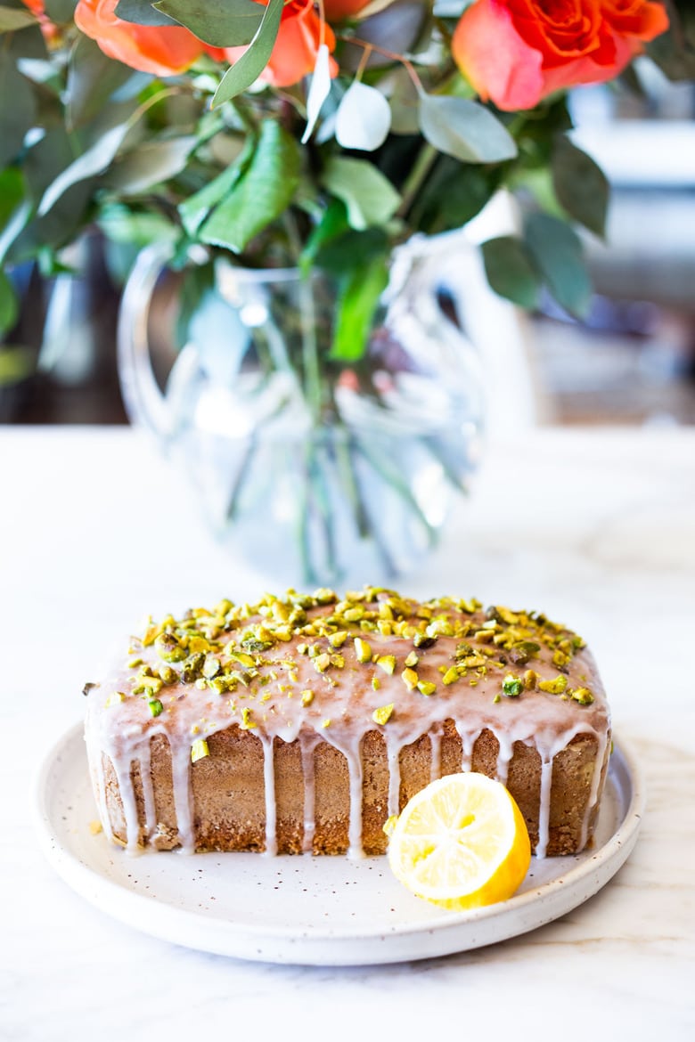 Meyer Lemon Loaf Cake with Toasted Pistachios and Lemony Glaze. The perfect balance between tart and sweet. #lemonloaf