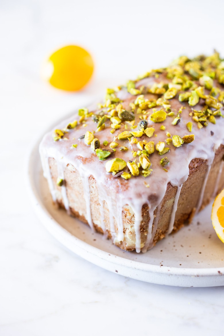 Meyer Lemon Loaf Cake with Toasted Pistachios and Lemony Glaze. The perfect balance between tart and sweet. #lemonloaf