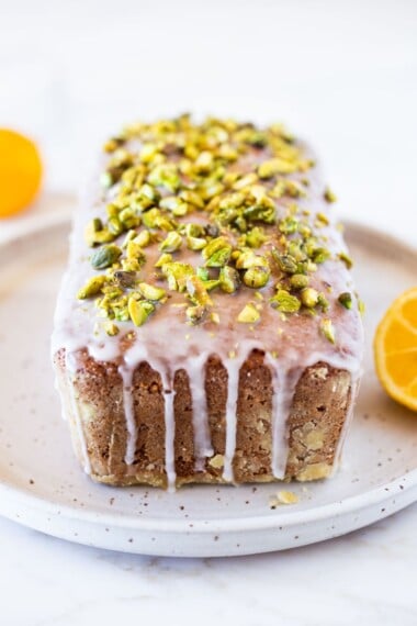 Meyer Lemon Loaf with Toasted Pistachios and Lemony Glaze. The perfect balance between tart and sweet. #lemonloaf