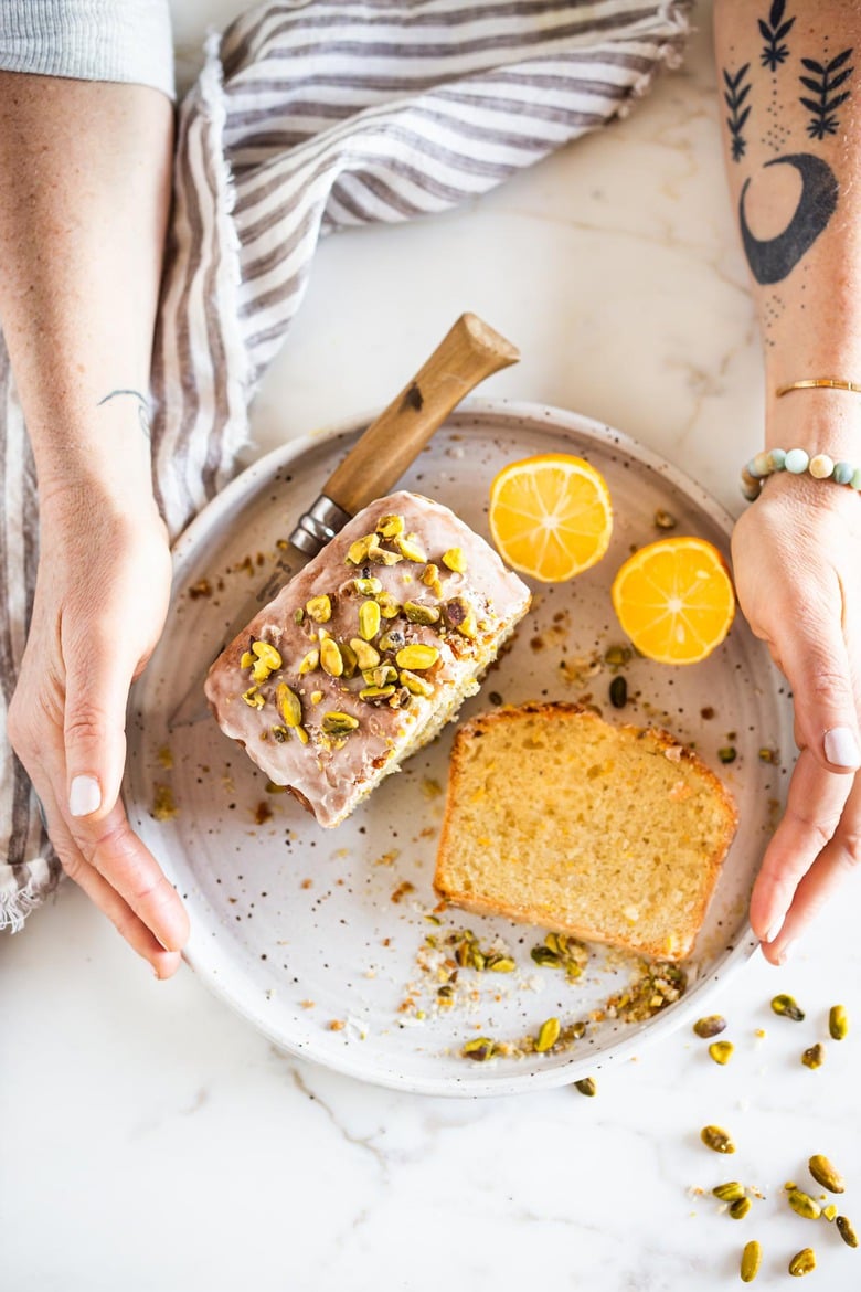 Meyer Lemon Loaf Cake with Toasted Pistachios and Lemony Glaze. The perfect balance between tart and sweet. #lemonloaf