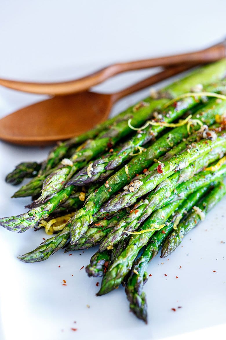 Simple Roasted Asparagus with olive oil, garlic, lemon zest, baked in the oven at 400F, in about 20 minutes! A fast, easy, healthy, vegan, vegetable side dish that pairs with so many things!