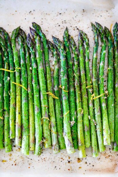 Simple Roasted Asparagus with olive oil, garlic, lemon zest, baked at 400F, in about 20 minutes. A fast, easy, healthy vegetable side dish that pairs with so many things!