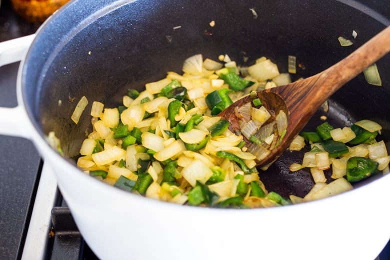 saute onion, garlic, poblanos and jalapeno