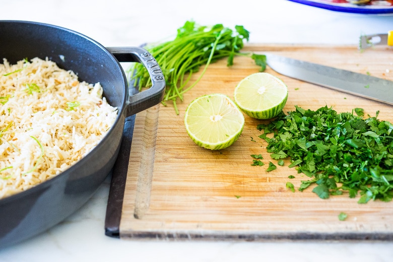 adding cilantro and lime to the rice 