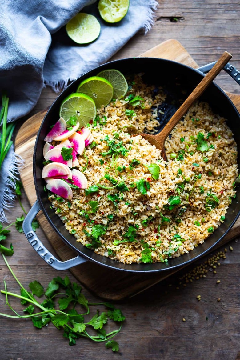 An easy healthy recipe for Cilantro Lime Rice that is made on the stovetop. Make this with brown or white basmati rice ( or jasmine!). #rice #cilantrolimerice #mexicanrice 