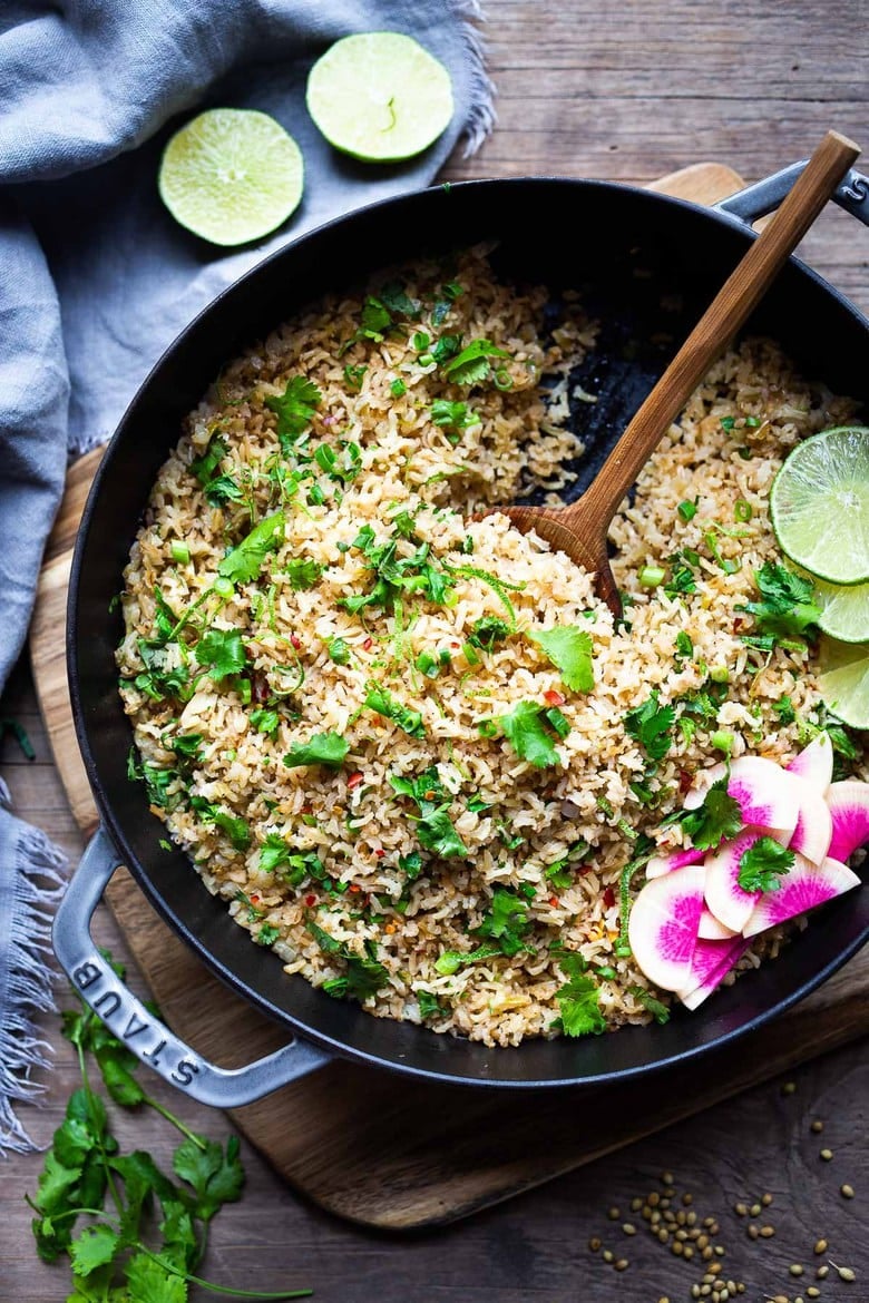 An easy healthy recipe for Cilantro Lime Rice that is made on the stovetop. Make this with brown or white basmati rice ( or jasmine!). #rice #cilantrolimerice #mexicanrice 