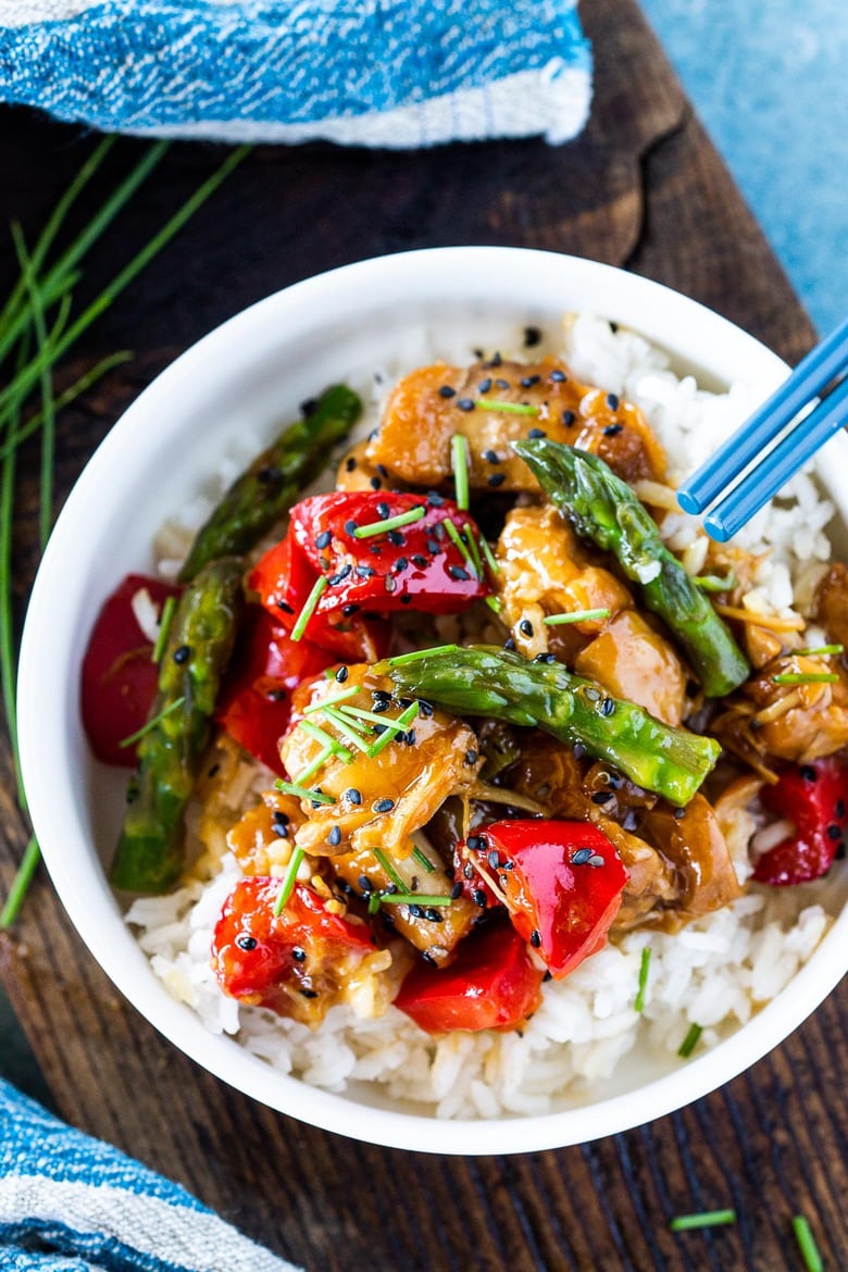 Instant Pot Teriyaki Chicken with bell pepper and asparagus served over rice in a bowl