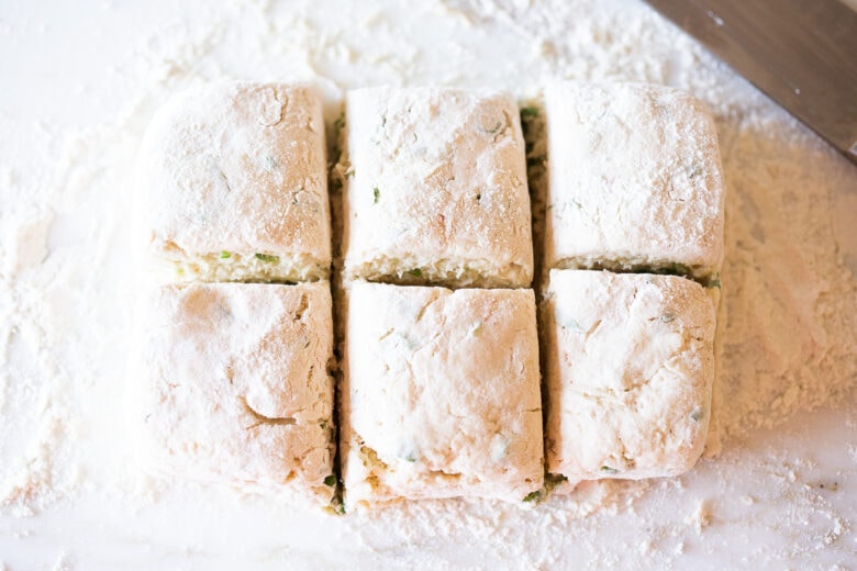 Biscuit dough cut into shapes for sourdough biscuits.