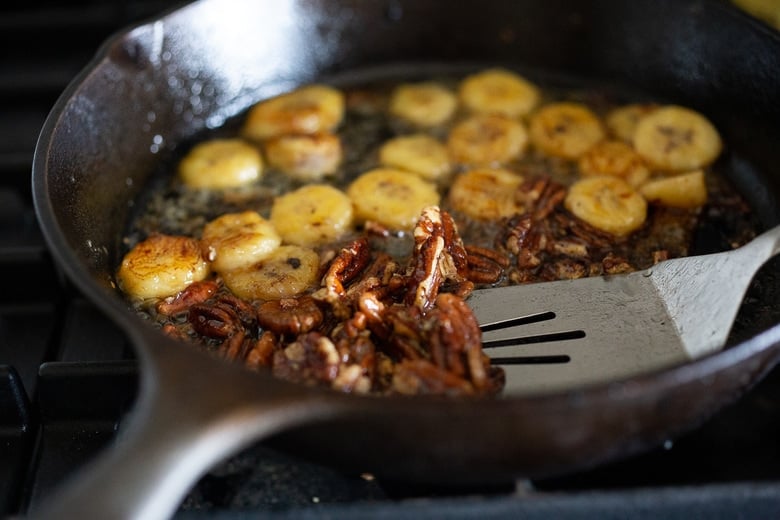 Maple glazed pecans and bananas over sourdough pancakes