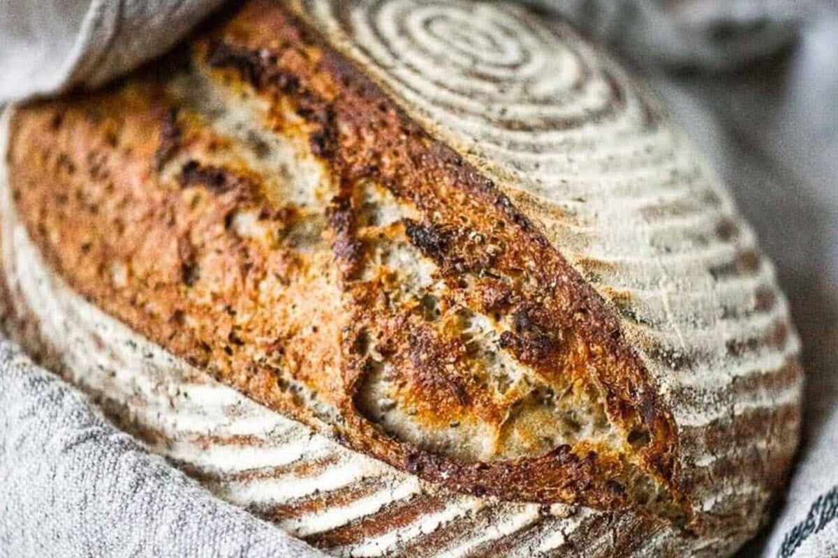 A loaf of sourdough bread out of the oven. 