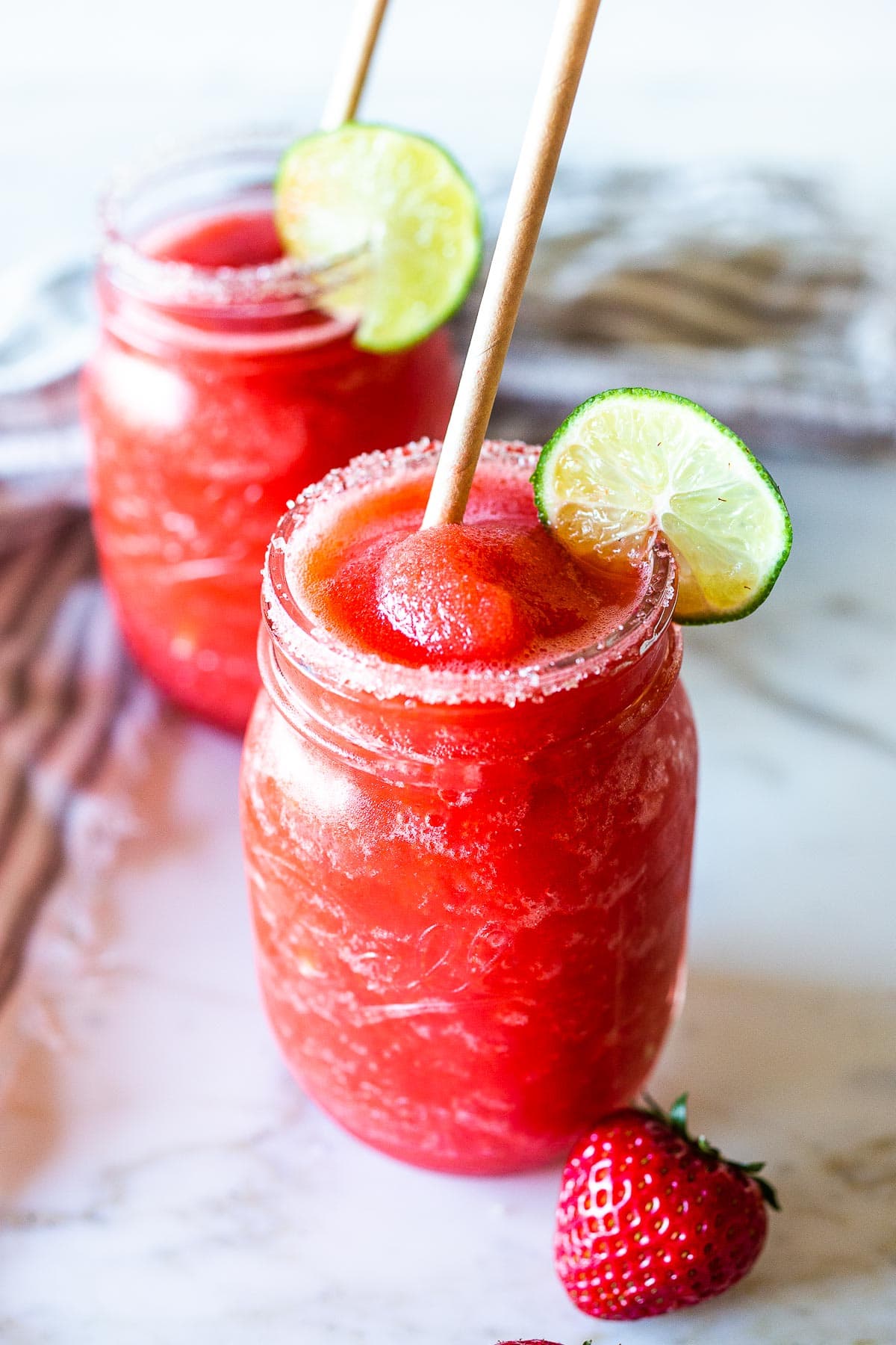 Say hello to the best Strawberry Margaritas made with  fresh, ripe, juicy strawberries! These "frozen" Strawberry Margaritas are light and refreshing and go down a little too easily! Naturally sweetened, nicely balanced with the best flavor! 
