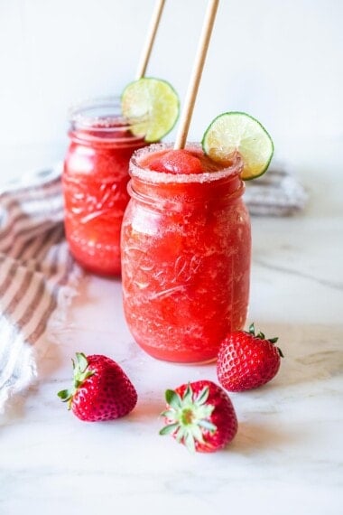 Say hello to the best Strawberry Margaritas made with  fresh, ripe, juicy strawberries! These "frozen" Strawberry Margaritas are light and refreshing and go down a little too easily! Naturally sweetened, nicely balanced with the best flavor! 