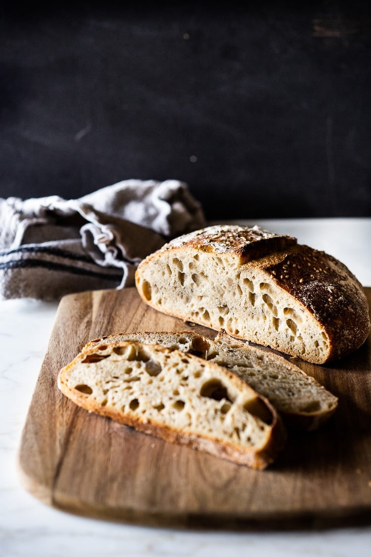 An EASY recipe for No Knead Sourdough Bread that rises overnight and is baked in the morning. #sourdough 