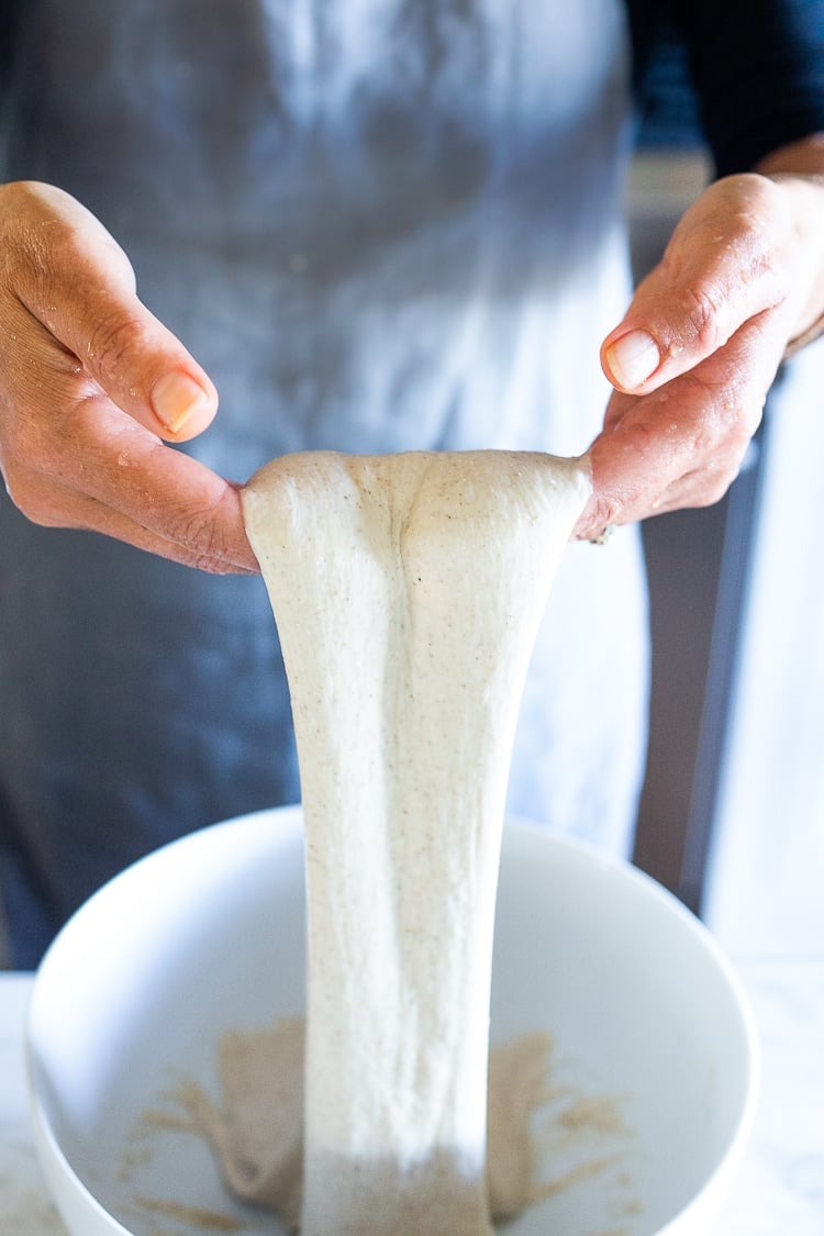 An EASY recipe for No Knead Sourdough Bread that rises overnight and is baked in the morning. #sourdough