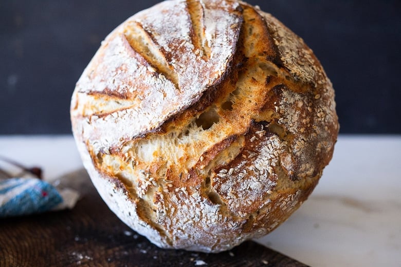 An EASY recipe for No Knead Sourdough Bread that rises overnight and is baked in the morning. #sourdough