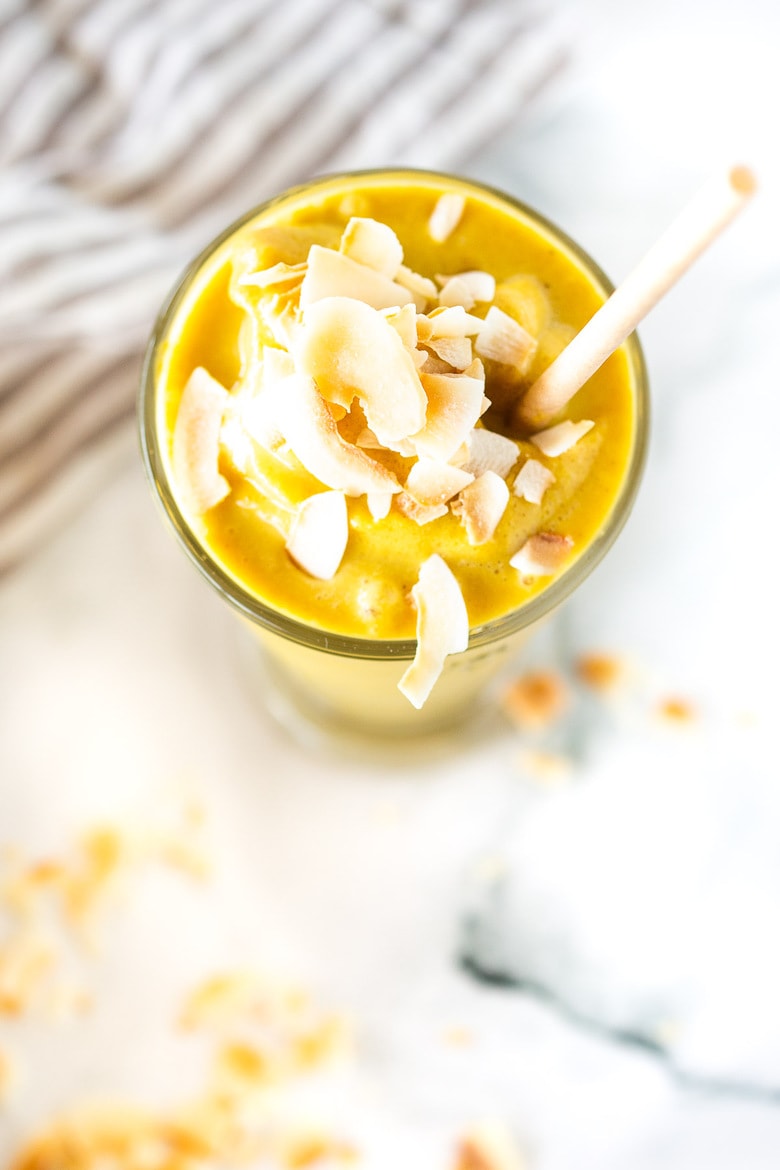 This Toasted Coconut Smoothie is like pillows of sunshine! Sugar-free, it's sweetened with date and bananas. Turmeric, ginger, cinnamon and vanilla give it a hint of the exotic. Vegan and Healthy - a happy start to your morning! #smoothie #vegansmoothie #coconut