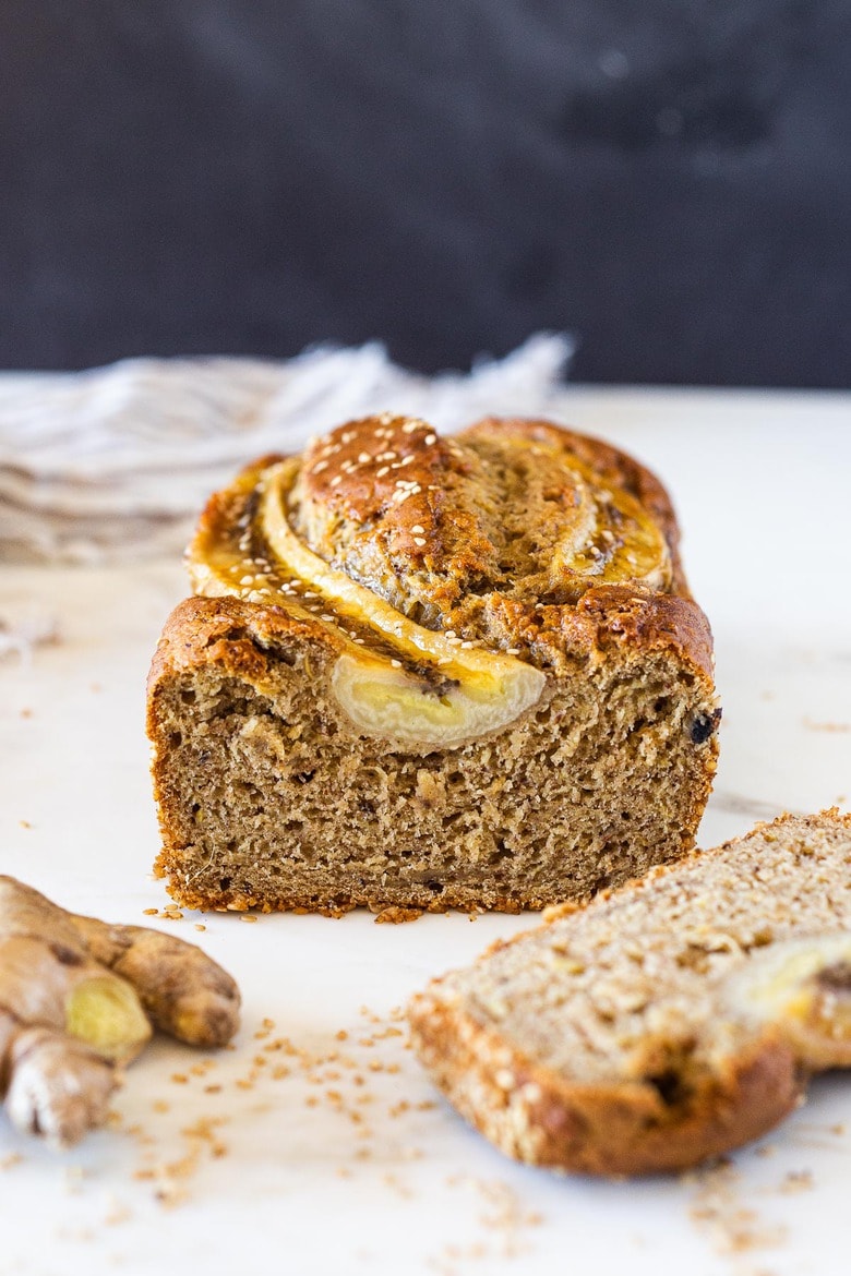 This Vegan Banana bread is not only healthy, it's made with sourdough starter or discard! Infused with ginger and sesame it is full of amazing flavor!  A simple potluck hit to share.  This is so yummy you may need to make two!#bananabread #veganbananabread #sourdough #yeastless