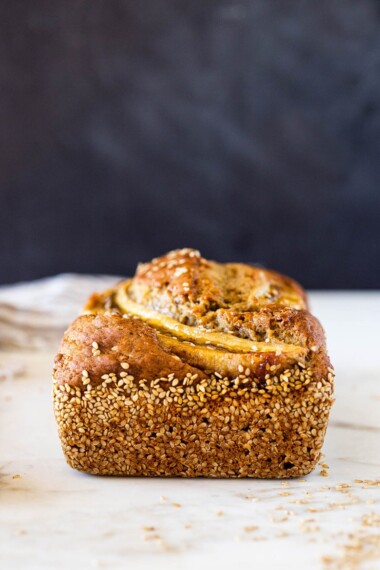 This Vegan Banana bread is not only healthy, it's made with sourdough starter or discard! Infused with ginger and sesame it is full of amazing flavor! #bananabread #veganbananabread #sourdough #yeastless