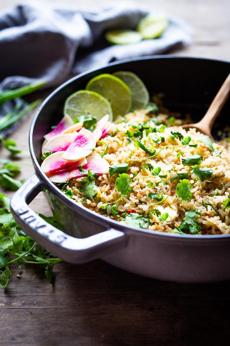 An easy healthy recipe for Cilantro Lime Rice that is made on the stovetop. Make this with brown or white basmati rice ( or jasmine!). #rice #cilantrolimerice #mexicanrice 