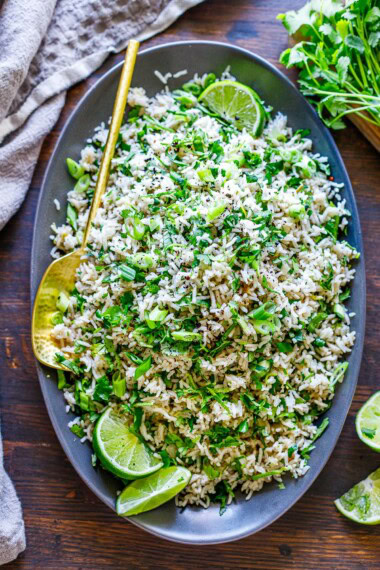 The best recipe for Cilantro Lime Rice with onion, garlic, lime, and cilantro, the perfect side dish for your Mexican feast! Better than Chipotle's. ;)