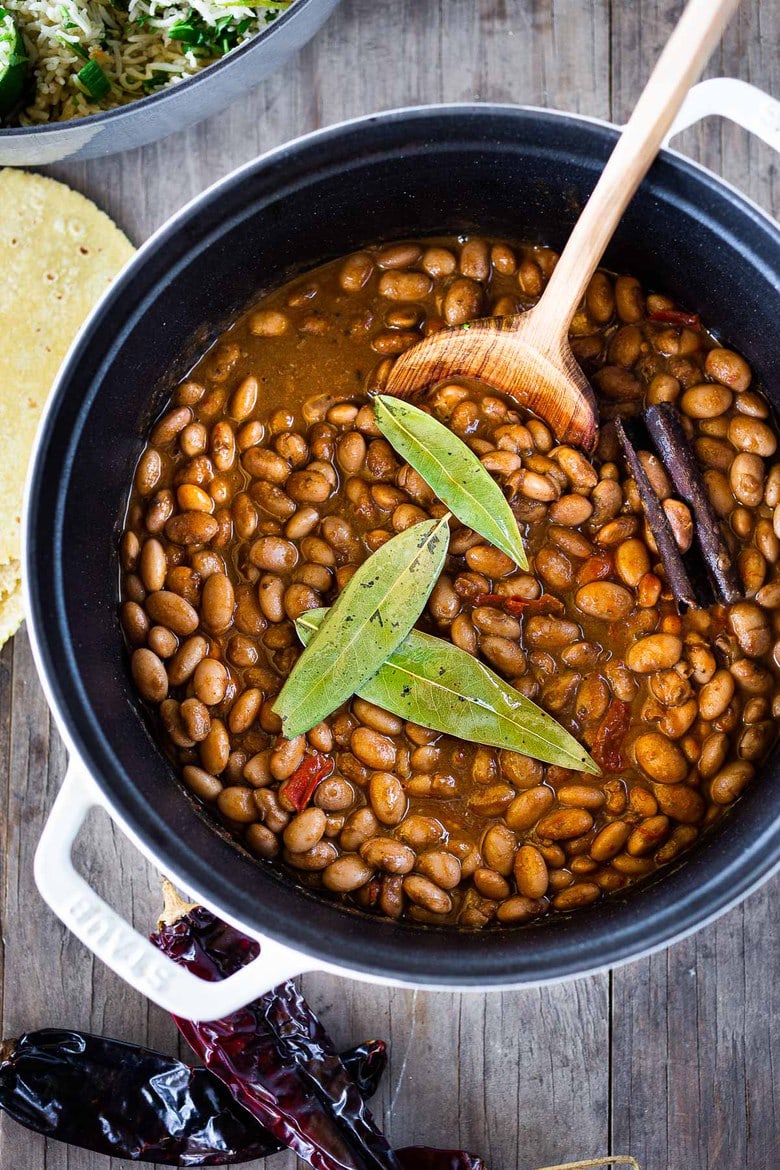 How to cook flavorful healthy vegan Mexican Pinto Beans using dry beans! A Simple easy recipe that can be made on the stovetop or in an Instant Pot. A delicious addition to your Mexican Feast, or weekly meal prep. It can be made ahead!  Allow 6 hours of soaking time.  #pintobeans