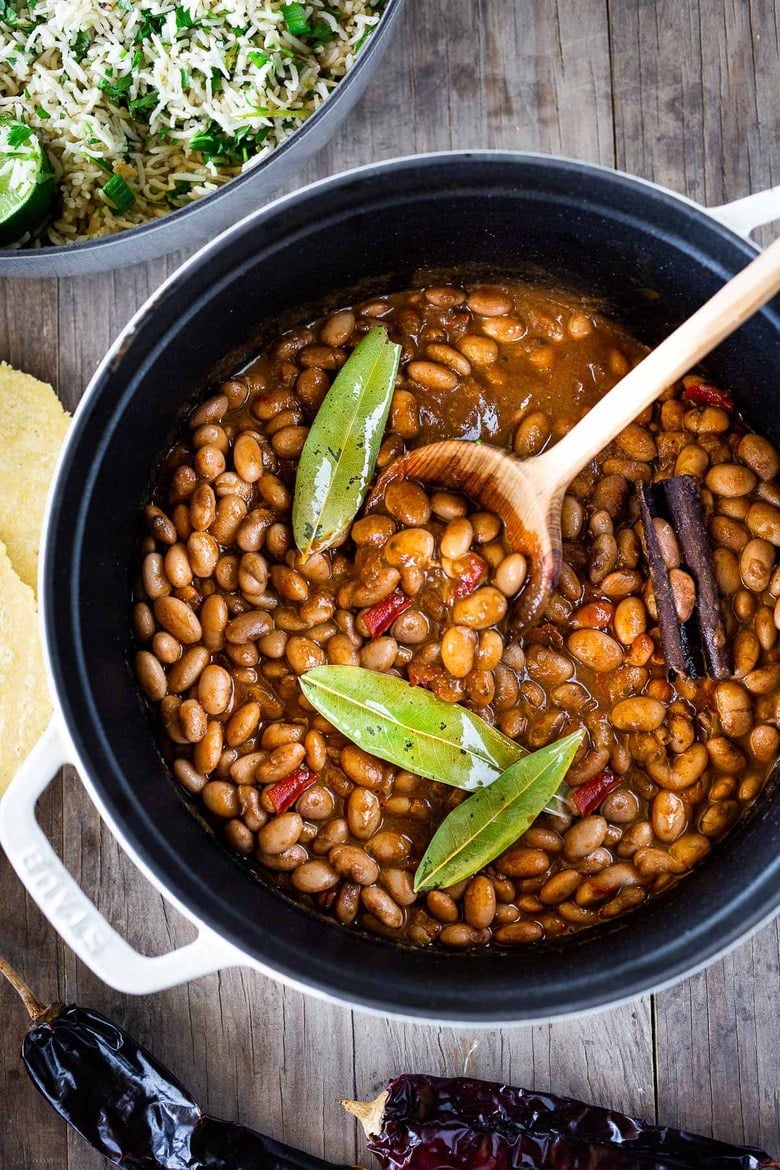 How to cook flavorful healthy vegan Mexican Pinto Beans using dry beans! A Simple easy recipe that can be made on the stove top or in an Instant Pot. A delicious addition to your Mexican Feast, or weekly meal prep. Can be made ahead!  Allow 6 hours soaking time. 