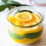 How to Preserve Lemons- a simple easy way to preserve lemons that only takes 10 minutes of hands-on time before letting mother nature take its course. Use in dressings, marinades, Middle Eastern Dishes and salad to add a burst of flavor. #preservedlemons