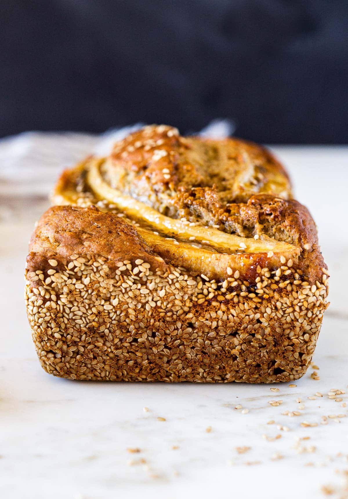 Here's a healthy, delicious recipe for Banana Bread with a toasty Sesame Seed Crust.  Infused with ginger, it's moist and flavorful. Vegan-adaptable, and can be made with sourdough starter.