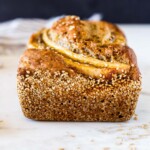 Here's a healthy, delicious recipe for Banana Bread with a toasty Sesame Seed Crust. Infused with ginger, it's moist and flavorful. Vegan-adaptable, and can be made with sourdough starter.