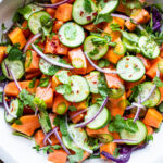A simple Mexican-inspired Papaya Salad using ripe papaya with cucumber, red onions, jalapeño over greens with a Cilantro Lime Dressing. #papayasalad