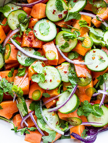 A simple Mexican-inspired Papaya Salad using ripe papaya with cucumber, red onions, jalapeño over greens with a Cilantro Lime Dressing. #papayasalad