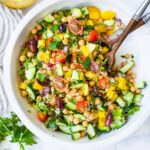 This Quinoa Salad is made with chickpeas, cucumber, tomato, kalamata olives dill, parsley and Preserved Lemon Dressing. A healthy vegan salad with Middle Eastern flavors that can be made ahead!