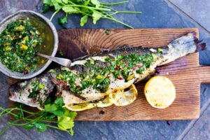 A simple recipe for grilled branzino topped with gremolata that can be made in 40 minutes. Plus how to grill whole fish.
