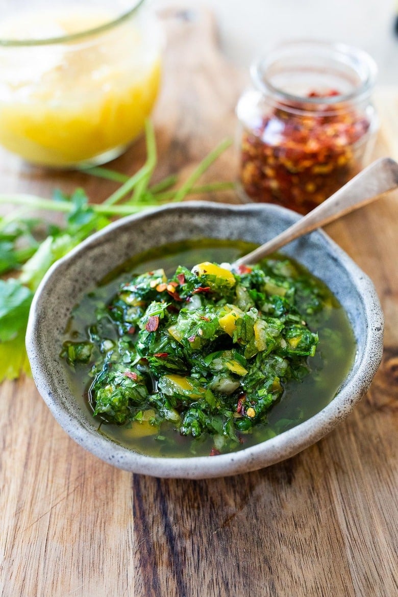 This herby green sauce is made with Preserved Lemons- flavorful and robust it is great on grilled meat and fish and tossed in salads!