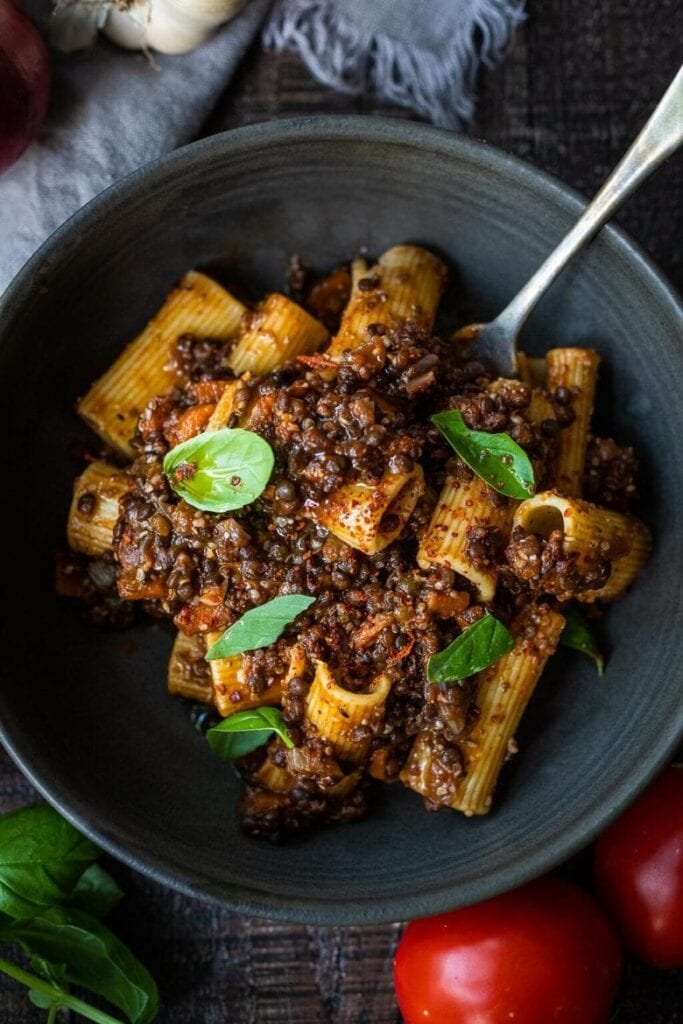 This vegan Lentil Bolognese is so hearty and cozy- you won't miss the meat! We use walnuts and lentils to give this its meaty flavor! It's one of the most favorited pasta recipes on the blog and we know your whole family will love it! Give it a go. Keep it vegan or top with parmesan cheese, up to you!  We also have our Turkey Bolognese!